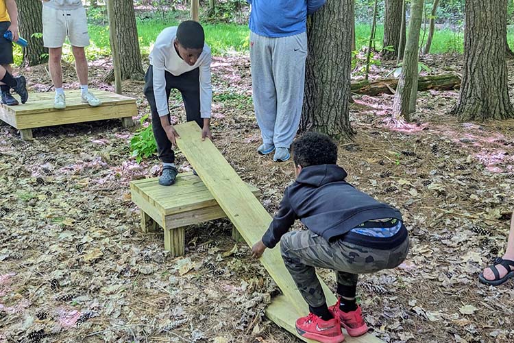 Sixth graders from Cleveland's Garfield School tackle challenges in the woods at Camp Ho Mita Koda